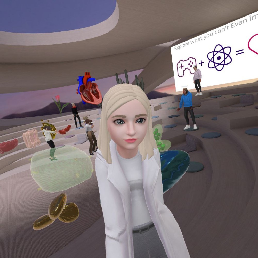 XReady Lab's biology teacher captured a virtual selfie during a biology class at Spatial, featuring students exploring 3D models of a heart and cell organelles through their 3D avatars